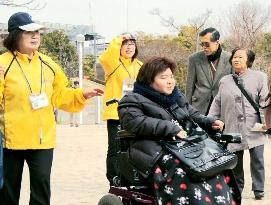 Wheelchair-bound woman joins experimental tour aided by coordinators