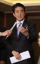 Abe, Park hold 1st talks amid row over "comfort women" issue