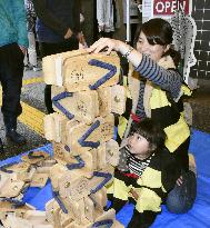 Clog-stacking contest held in west Japan city famous for comics