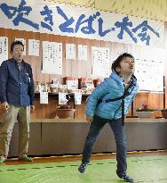Persimmon seed-spitting contest held in western Japan