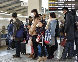 Travelers heading home for New Year's holidays