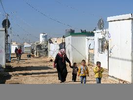 Syrian mother, child at refugee camp in Jordan