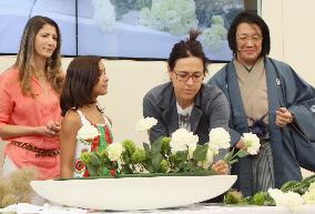 Milan expo visitors try flower arrangement at Japan Pavilion