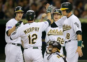 A's trounce Hanshin 10-2, Murphy hits grand slam