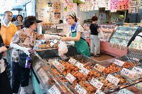 Long queue for cheap chicken dishes in Tokyo's Jujo Ginza