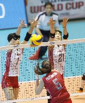 Japanese players block Russian spike in Women's World Cup volleyball