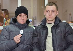 Ukrainian mother, son speak of escape from besieged city