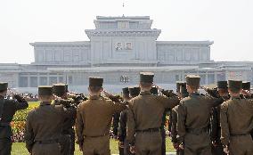 Soldiers salute in front of Pyongyang palace on "Day of Sun"