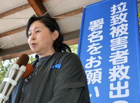 Ex-abductee Soga speaks to press during rally