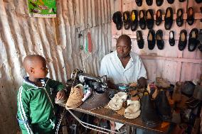 Kenyan man runs shoe shop in huge Kibera slum