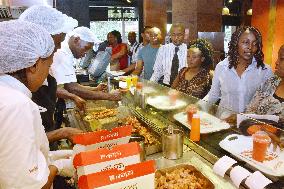 People queue up at "teriyaki" grilled chicken restaurant in Nairobi