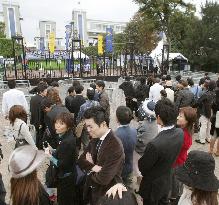 Japanese visitors at Longchamp racecourse
