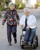 Nagasaki A-bomb survivor walks wheelchair-bound husband