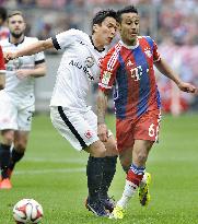 Frankfurt's Hasebe in action against Bayern