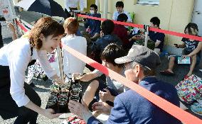 People in western Japan wait for opening of Starbucks shop