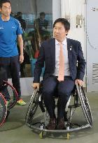 Sports agency chief rides wheelchair for hands-on experience in Tokyo