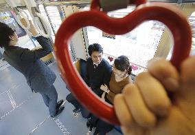 Tokyo railway starts running "love train" with heart-shaped straps