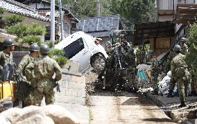 Cleaning resumes in disaster-hit western Japan