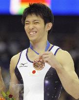 Tanaka wins bronze in parallel bars at world championships