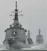 Japan destroyer test-fires missile at review