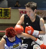 Japan's Koseki defends women's atom weight title