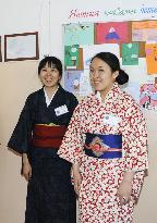2 Japanese teachers pose at grade school in Russia's Tuva Republic