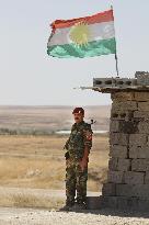 Kurdish soldier on guard against Islamic militants in northern Iraq