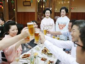 Geisha welcome beer garden customers