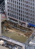 Huge sinkhole near major train station disrupts Fukuoka