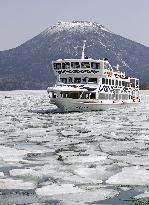 Sightseeing boat on icy Lake Akan in Hokkaido
