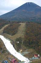 People take to artificial ski slope at foot of Mt. Fuji