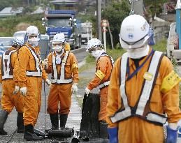 Cleanup work continues in village hit by nuke disaster