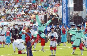 People dance during opening ceremony for sport festival in Mongolia