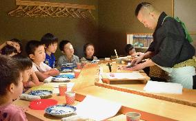 Michelin-starred sushi chef holds event for children
