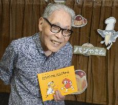 Children's book author shows his work