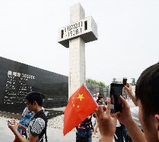 Visitors to Nanjing Massacre Museum take photos