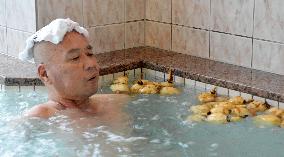 Bathing in lotus roots at Japanese public bath