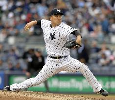 Tanaka gets no-decision in Yankees' win