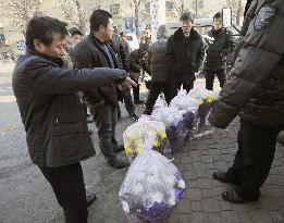 Flower seller at China-N. Korea border