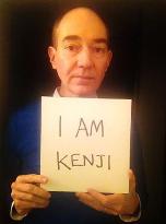 Univ. of Tokyo prof. Campbell holds 'I AM KENJI' card on Facebook