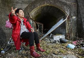 East Japan's 2011 disaster reminds old woman of WWII experience