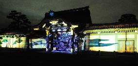 Colorful images illuminate Nijo Castle gate in Kyoto