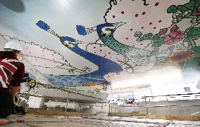 Osaka landmark tower's re-created ceiling mural unveiled to press