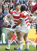 Japan's Yamada scores try against Samoa