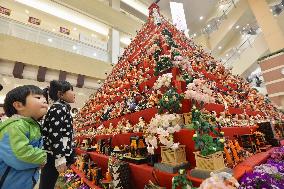 Pyramid decorated with dolls on display
