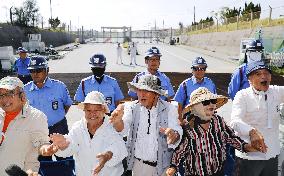 Protesters welcome new antibase Okinawa governor