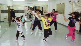 Children taking dance lesson