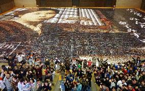 Mosaic made of 120,000 smiling face photos sets Guinness record