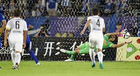 Hiroshima goalee Hayashi stops penalty kick by Yamagata MF Diego