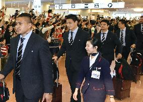 Japan rugby team returns home